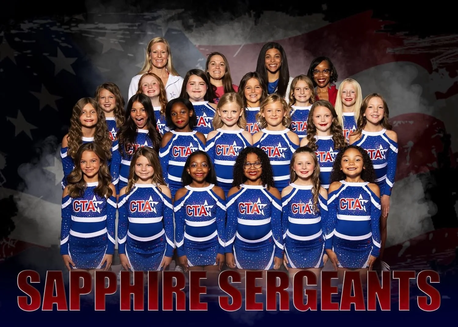 Group of young girls in choreographed cheerleading uniforms with a star motif, standing in front of an American flag background, with the text "Sapphire Sergeants" and a logo for Champions Training Academy.