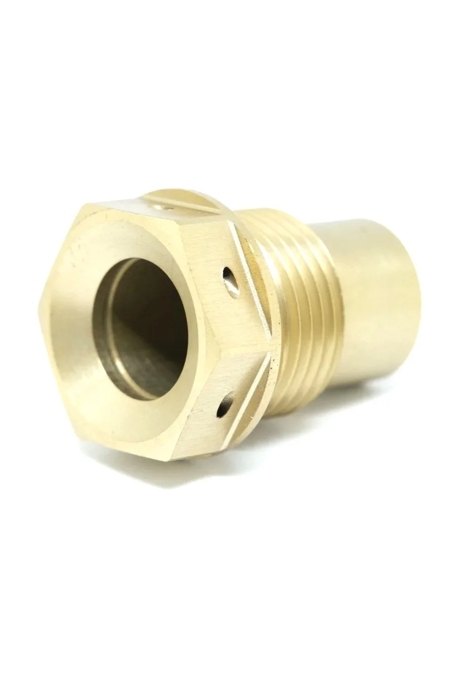 A close-up of a brass or metal threaded pipe fitting with a hexagonal section for tightening.