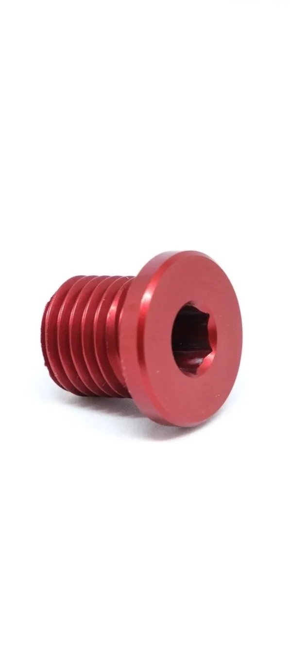 Red metal screw with a flat, wide head and threaded body, isolated on a white background.