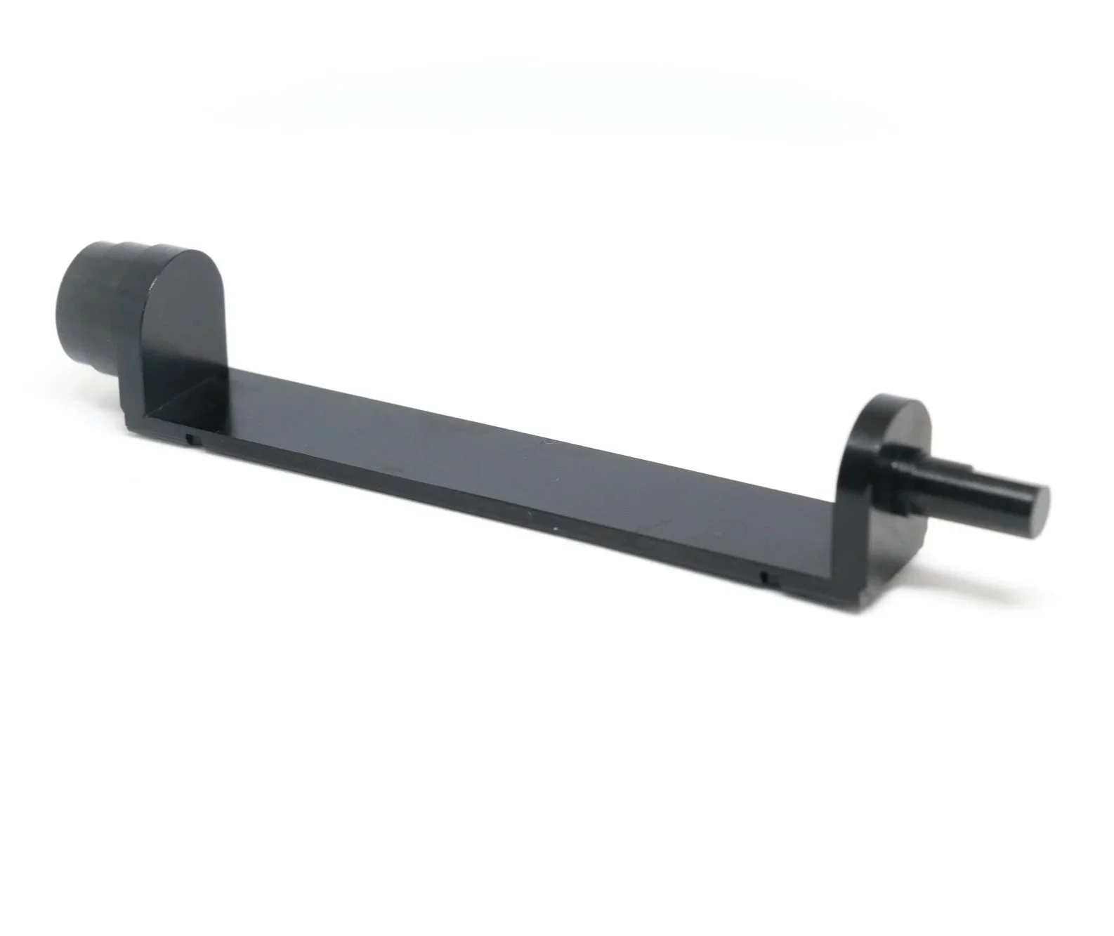 Black metal clamp or bracket with cylindrical ends on a plain white background.