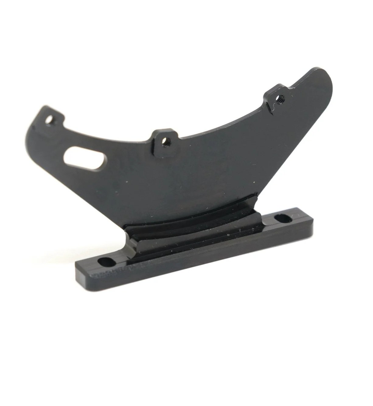 A black metal motorcycle brake caliper bracket with mounting holes.