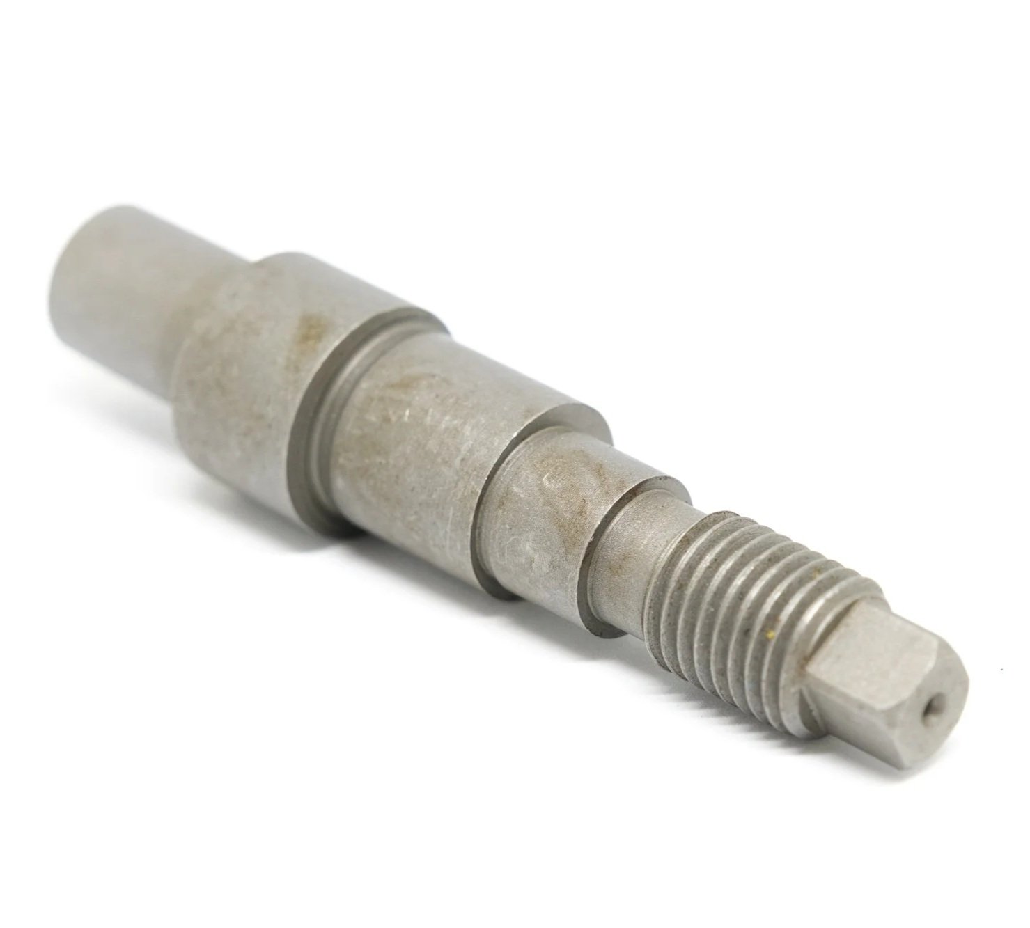 Metal threaded component, possibly a valve or screw, with a worn surface and multiple sections of different diameters.