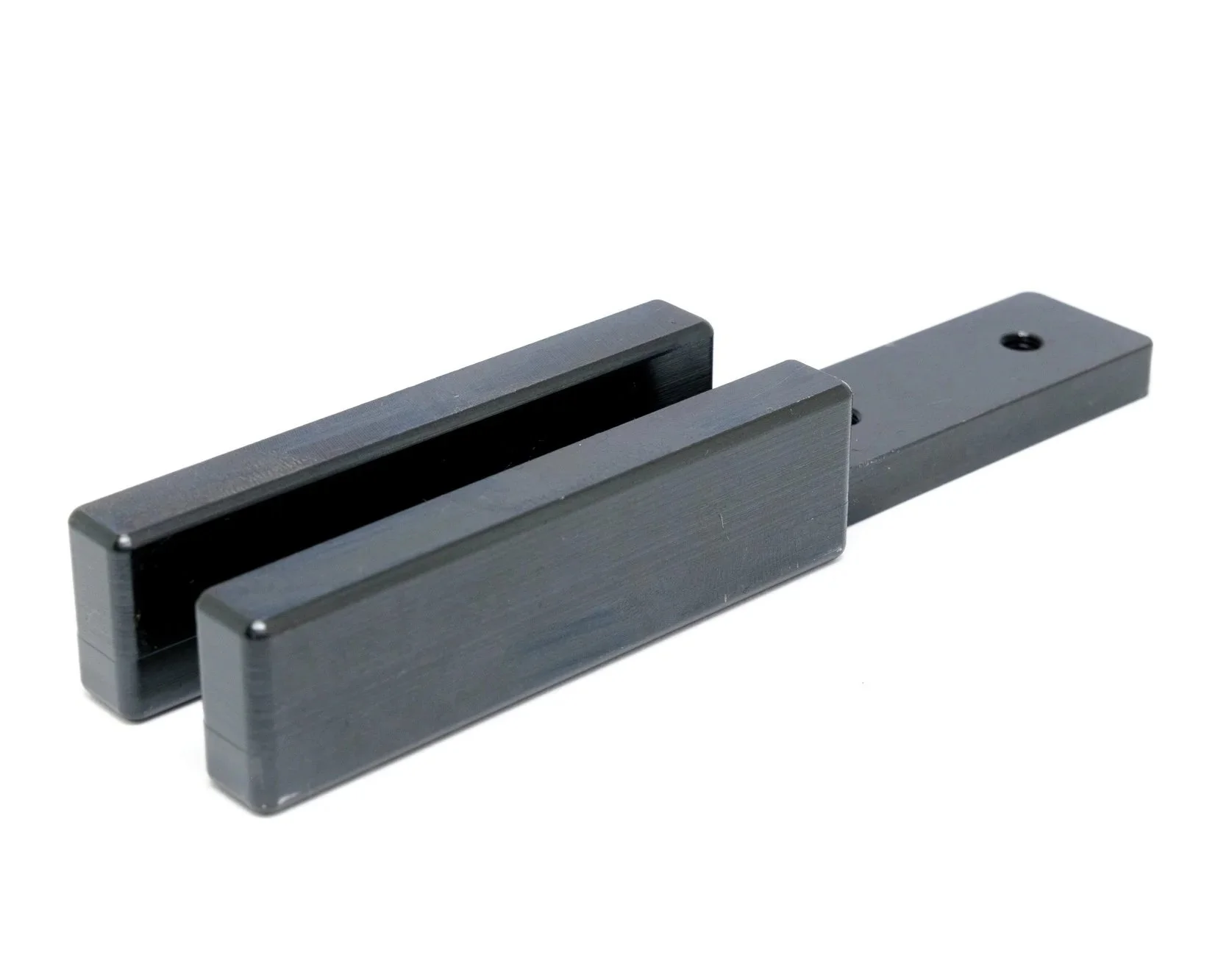 A black, two-piece linear scale or caliper with a sliding jaw against a white background.