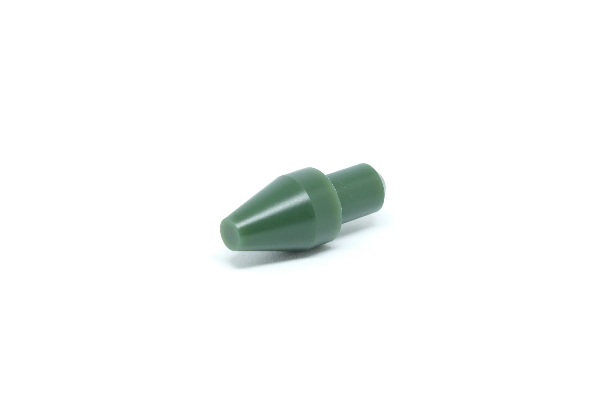A small green plastic cone-shaped object on a white background.