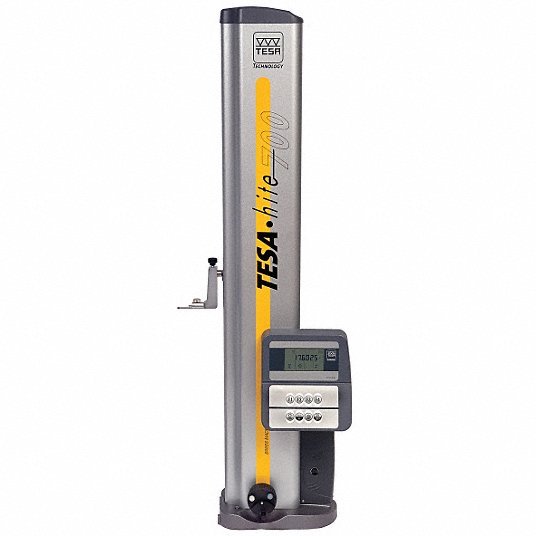 A tall, vertical testing instrument labeled 'TESA' with a digital control panel, a small spout on the side, and a yellow detection strip, used for surface testing or measurement.