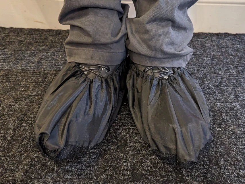 Handyman wearing shoe covers before entering a customer’s home.