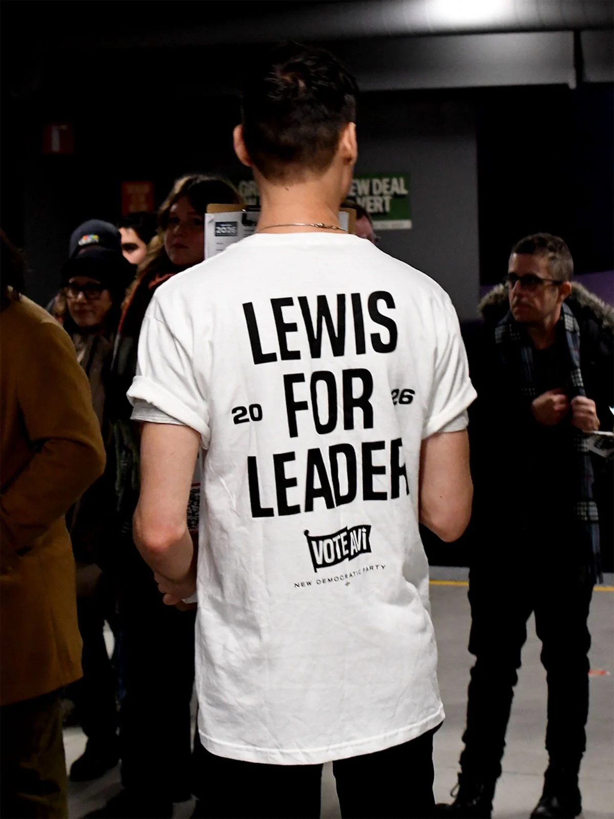Back of a person wearing a white Lewis for Leader t-shirt