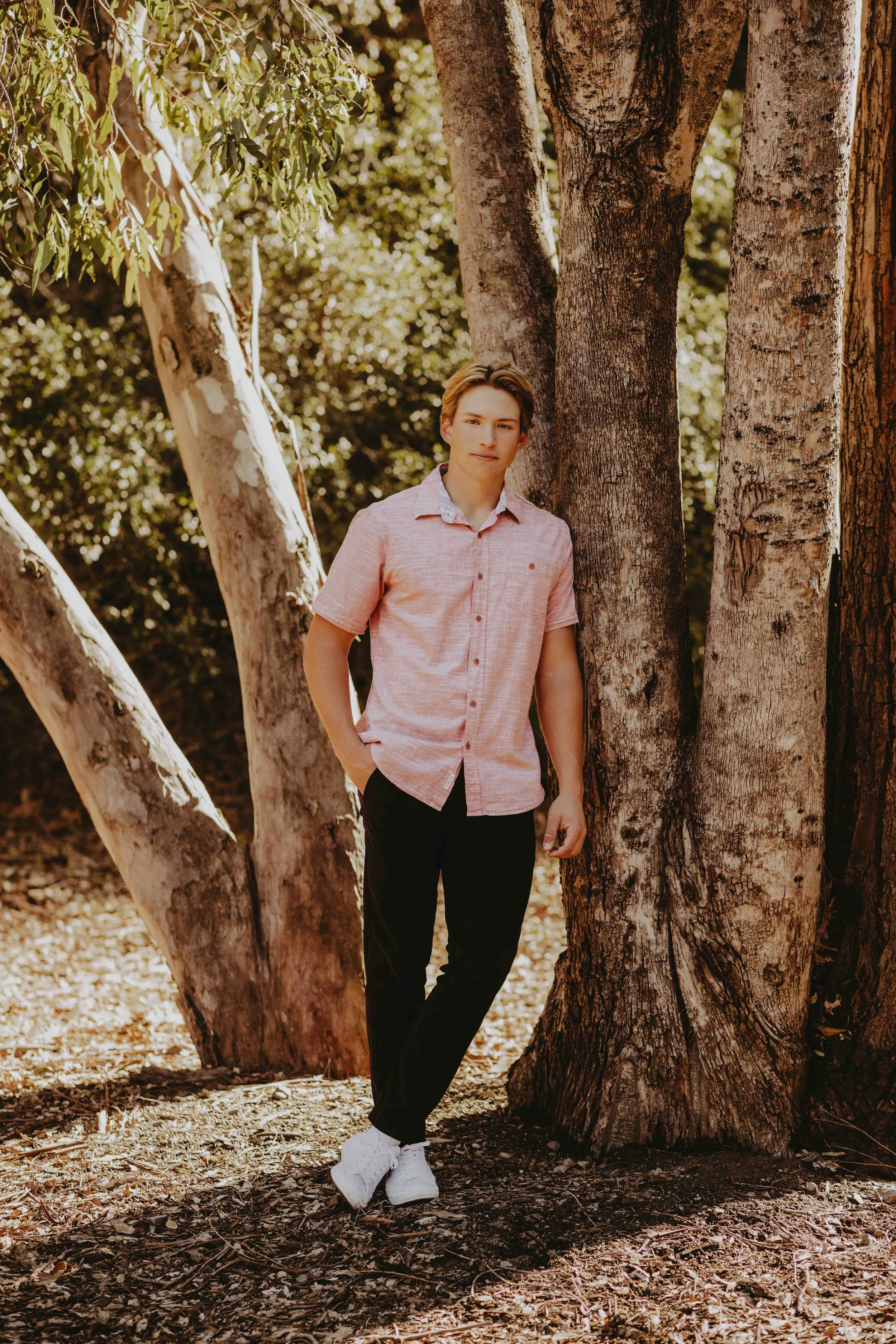 outdoor senior boy poses 
