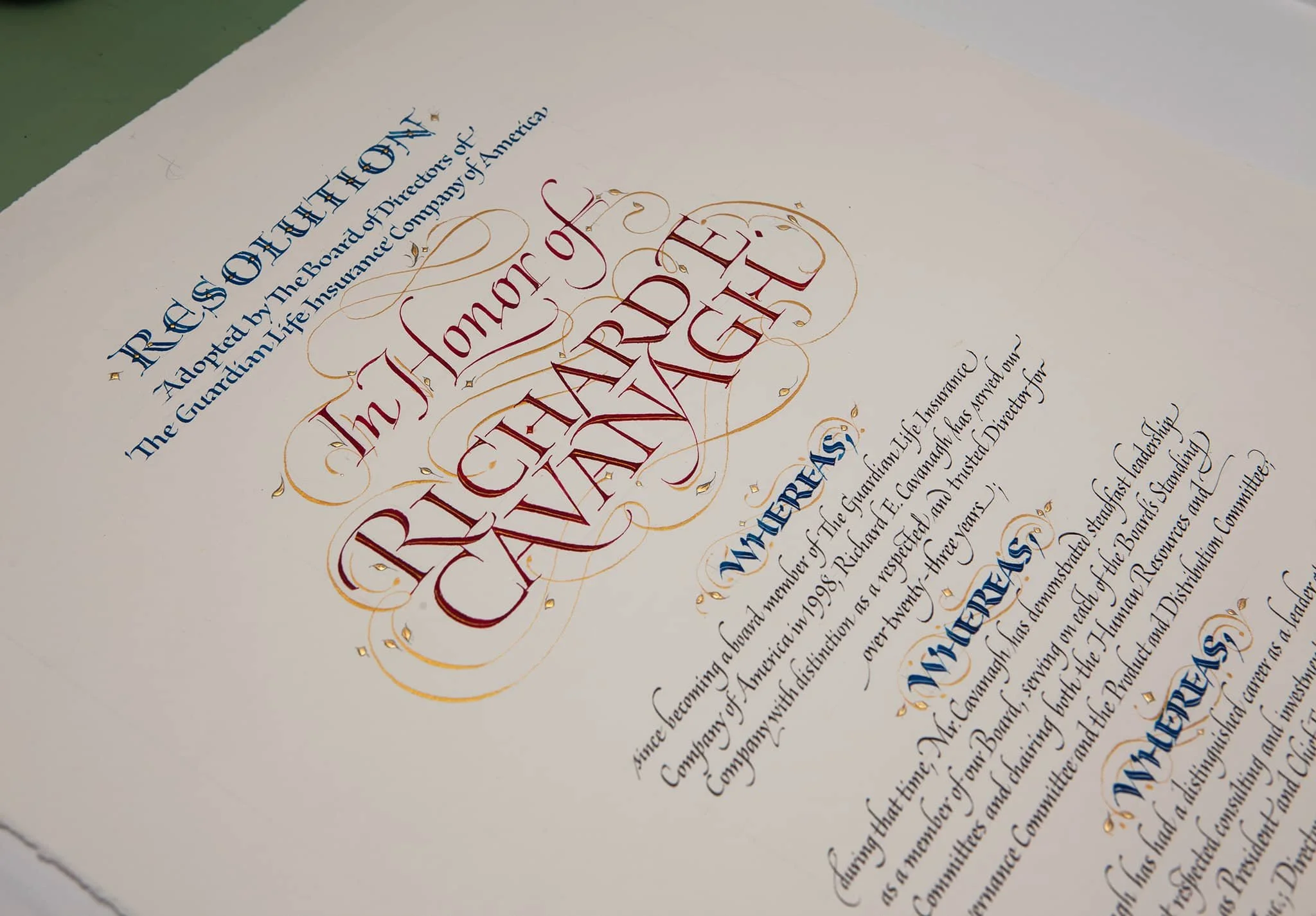 Calligraphic Resolution for corporate client retiring being honored. Design & Calligraphy by John Stevens. Pen calligraphy on Saunders paper.