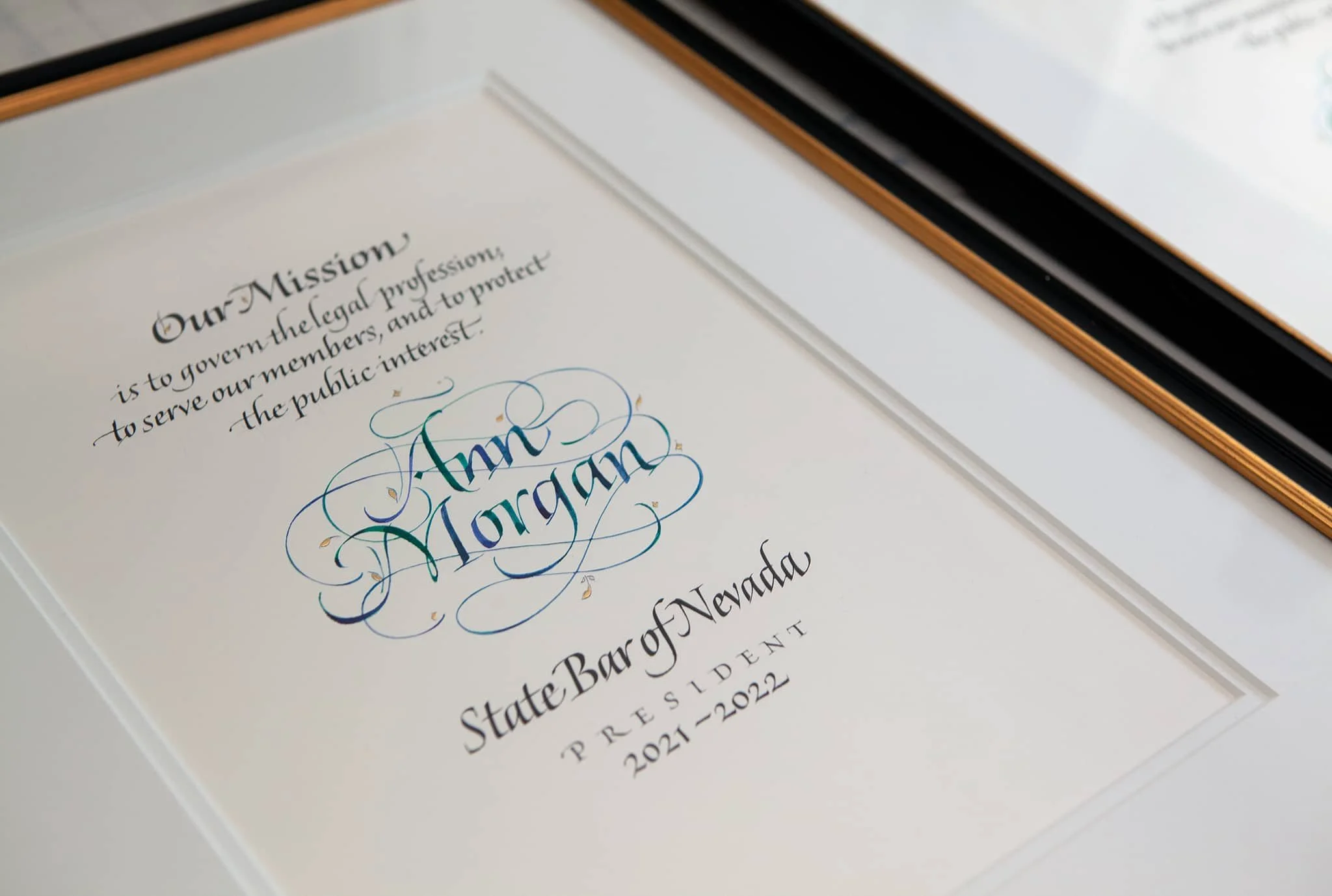 Honorary resolution: Design & Calligraphy by John Stevens. Pen calligraphy on Saunders paper.
