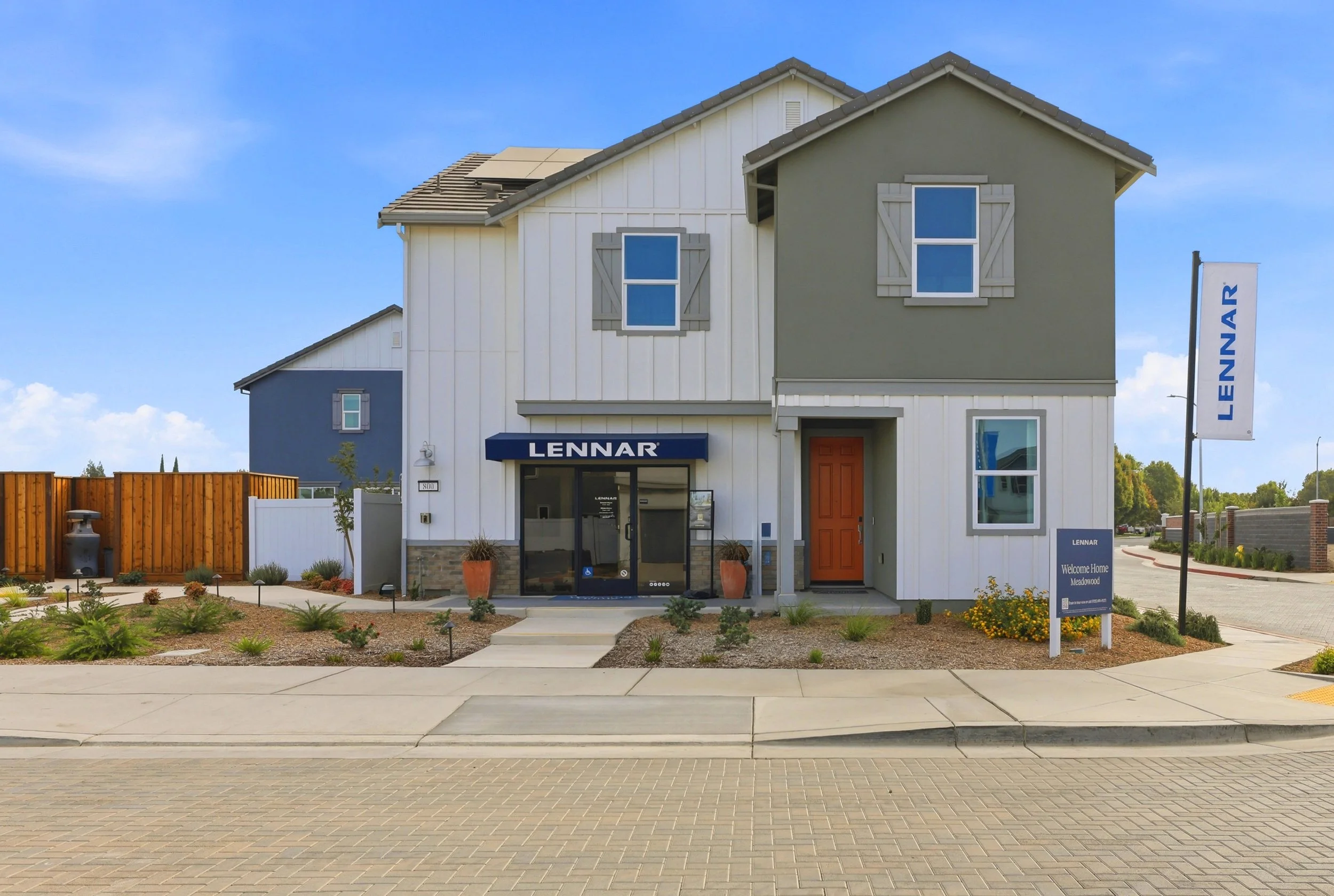 Two-story model home in Tracy with landscaped frontage and a covered entrance.
