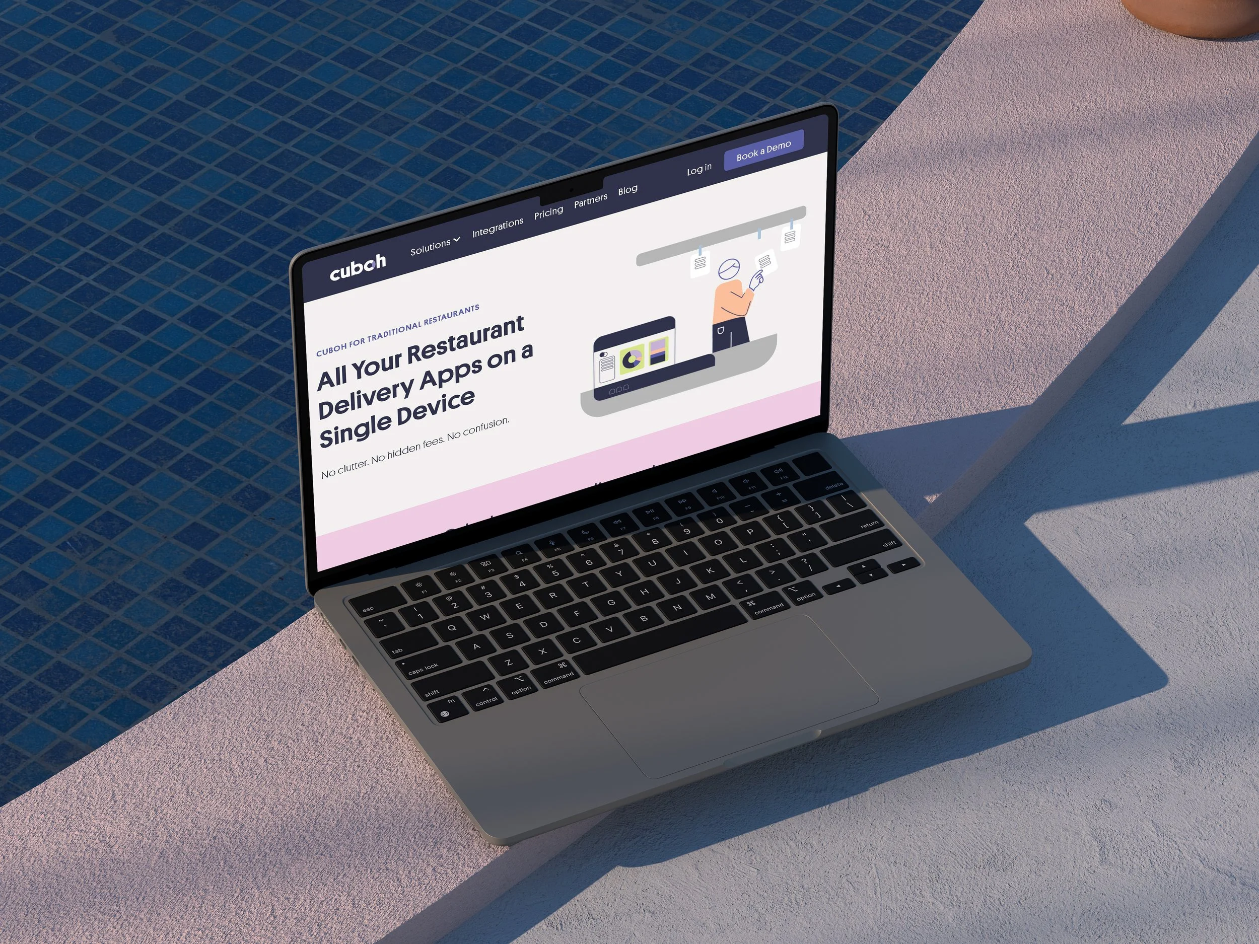 Laptop on a pink and white surface displaying a website for Cuboh, a restaurant delivery app platform.