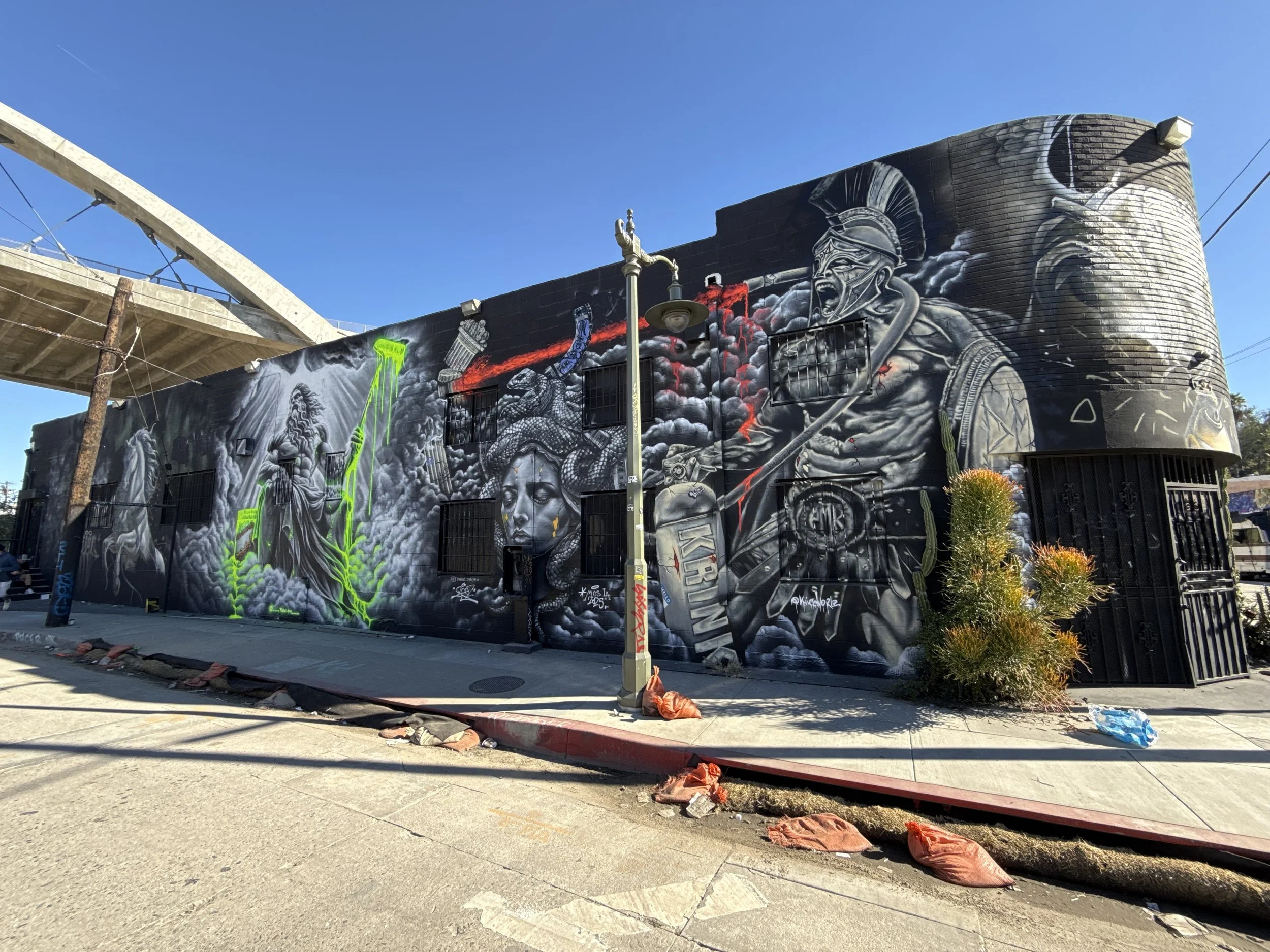 A trip to Los Angeles for Meeting of Styles became much more than another mural event. I painted a Greek warrior carrying a graffiti extinguisher alongside artists from around the world, became part of a new crew, and ended the trip painting “VENICE 