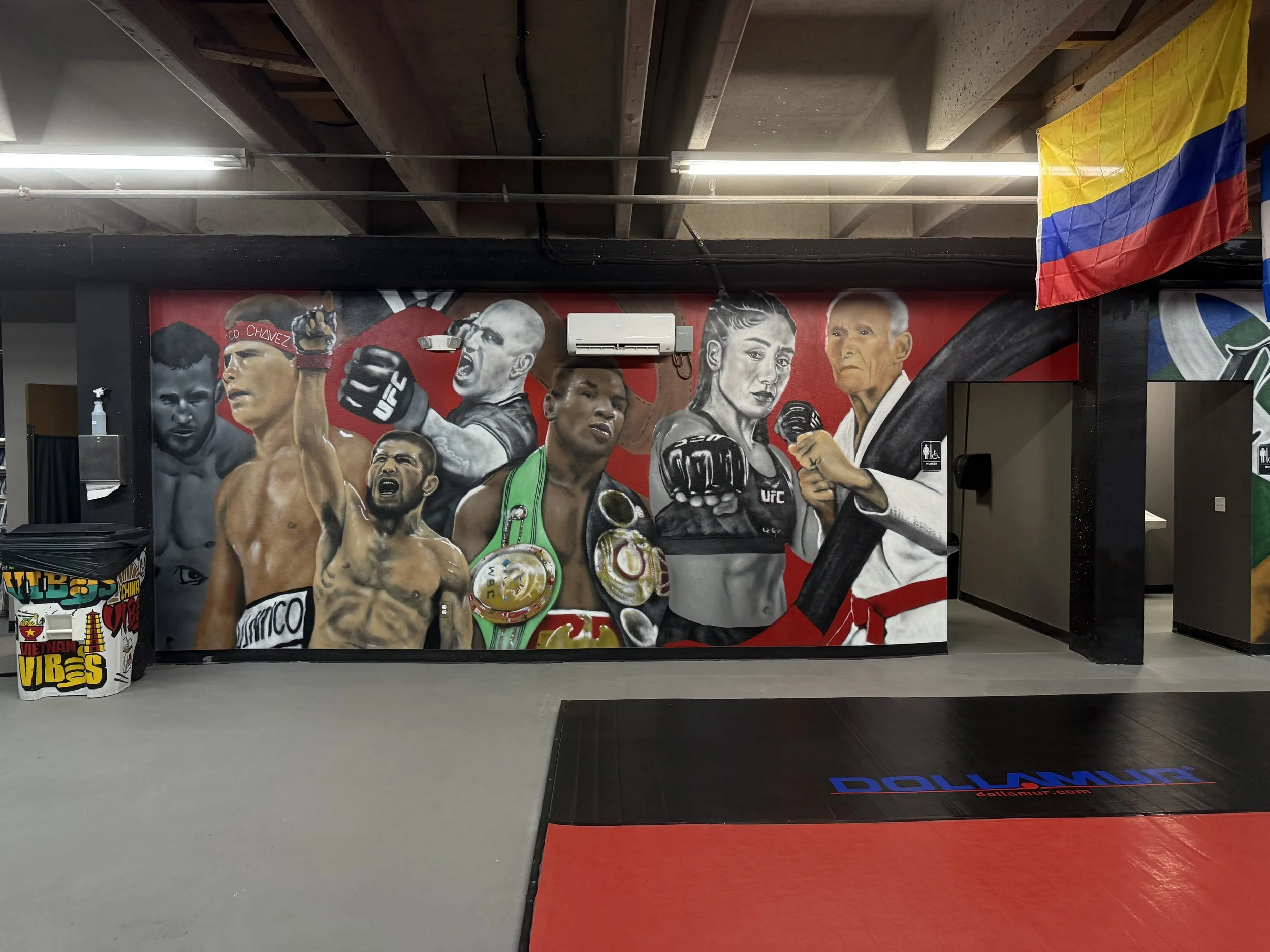 Justin Gaethje, Julio César Chávez, Alex Pereira, Mike Tyson, Alexa Grasso, Khabib Nurmagomedov, and Hélio Gracie come together in this mural celebrating fighters from different eras, cultures, and disciplines. Choosing only a handful was difficult, 