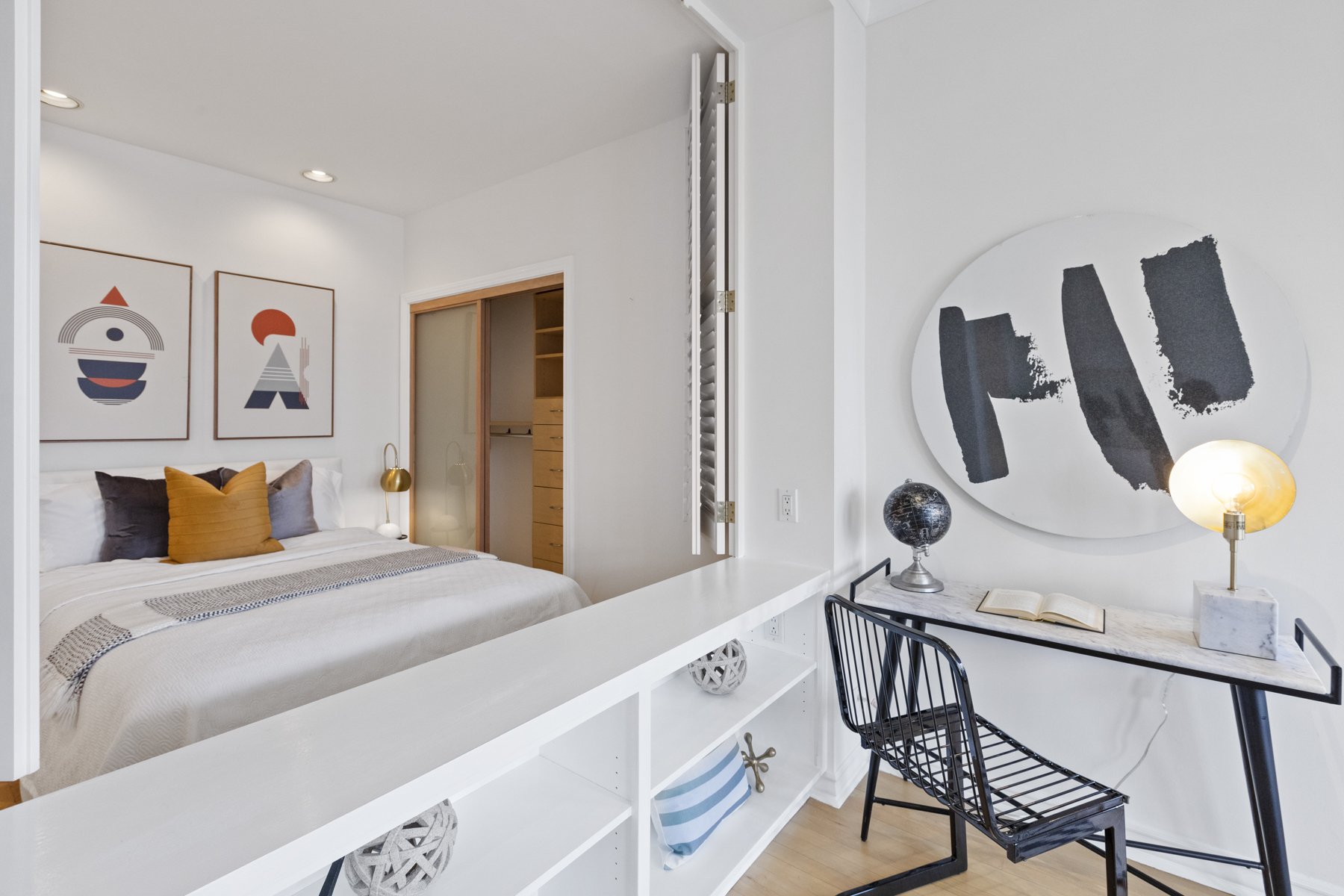 Real estate photography picture of a bedroom with office space.