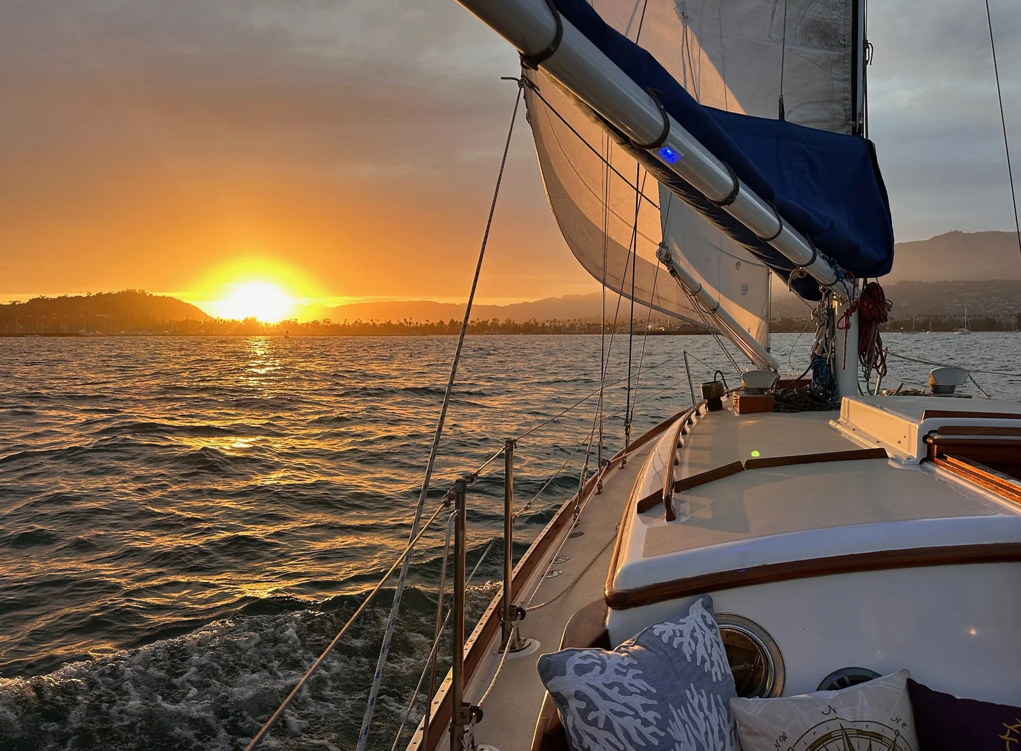 View from a private sailing yacht during sunset along the Santa Barbara coast.