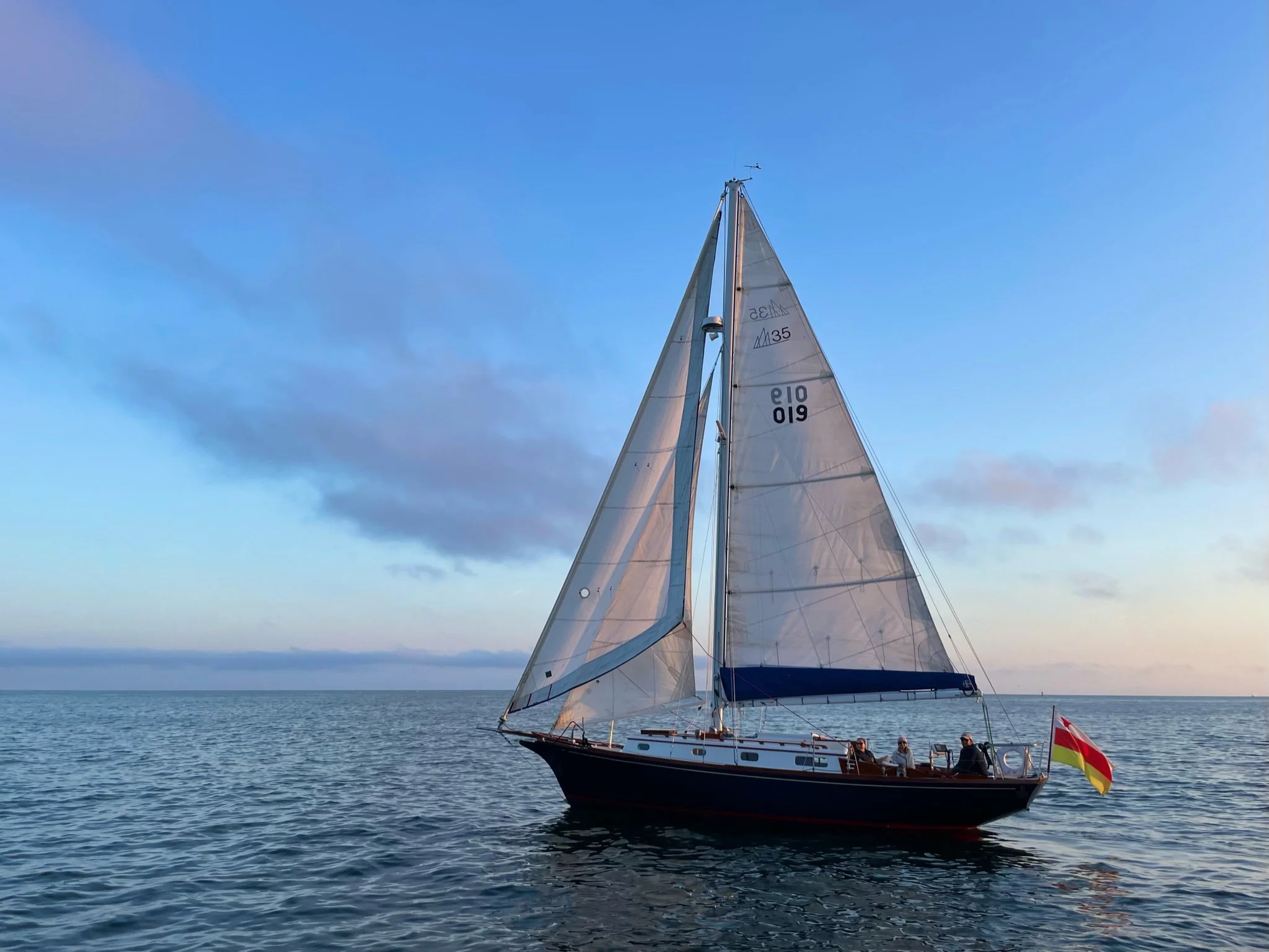 Yacht Kelpie sailing on the Santa Barbara coast with guests aboard