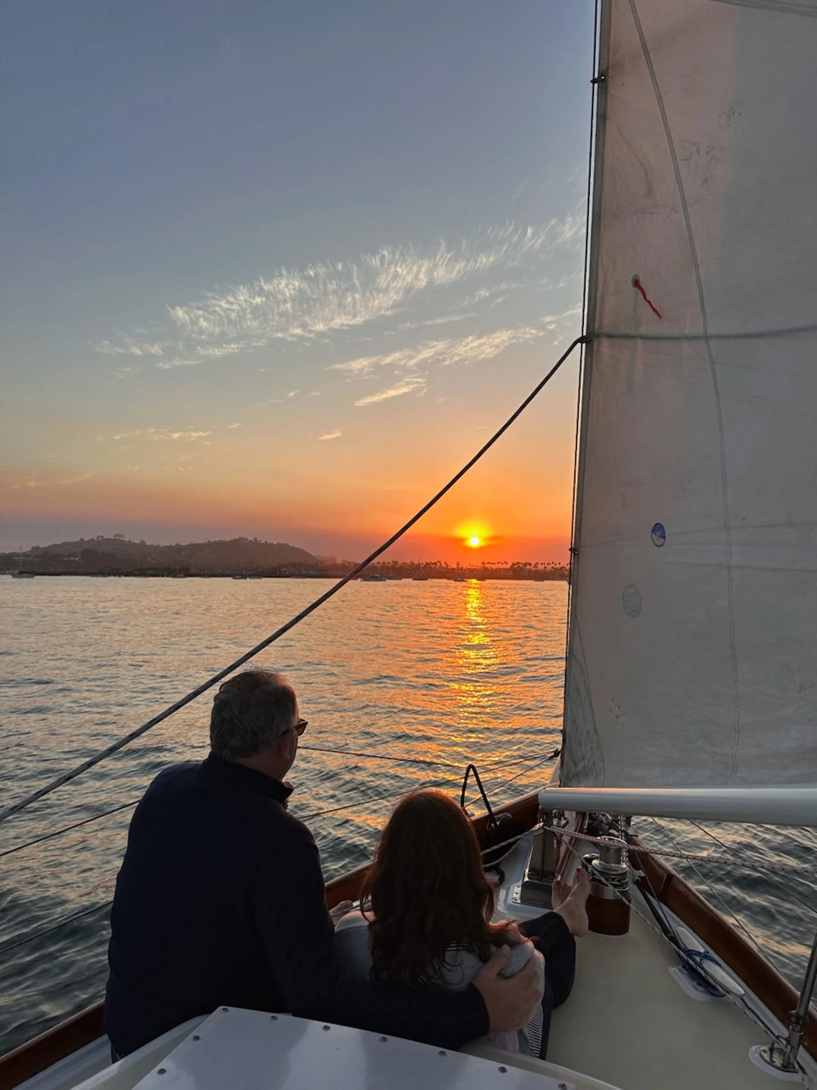 Guests enjoying a private sunset sail aboard Yacht Kelpie in Santa Barbara