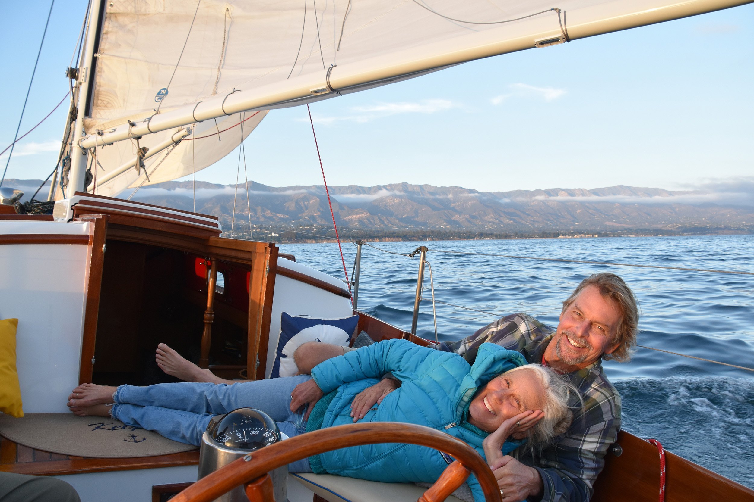Guests relaxing aboard Yacht Kelpie during a custom private sailing charter in Santa Barbara.