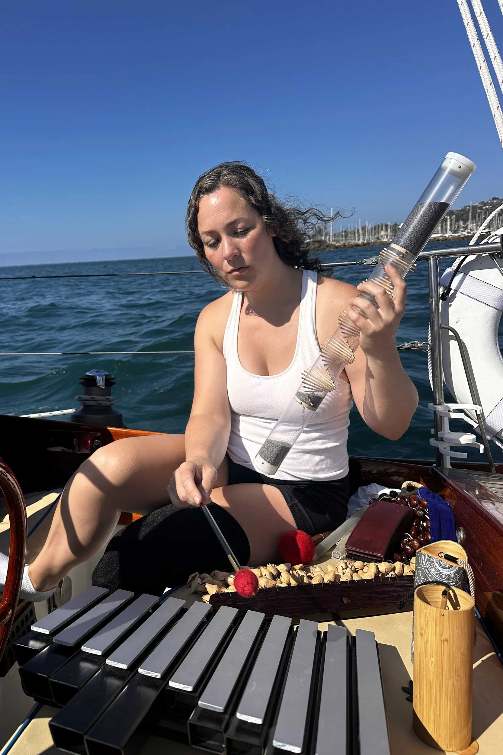 Becca Solodon leads a Healing Sound Bath Sail aboard yacht Kelpie for Teddy Bear Cancer Foundation families.