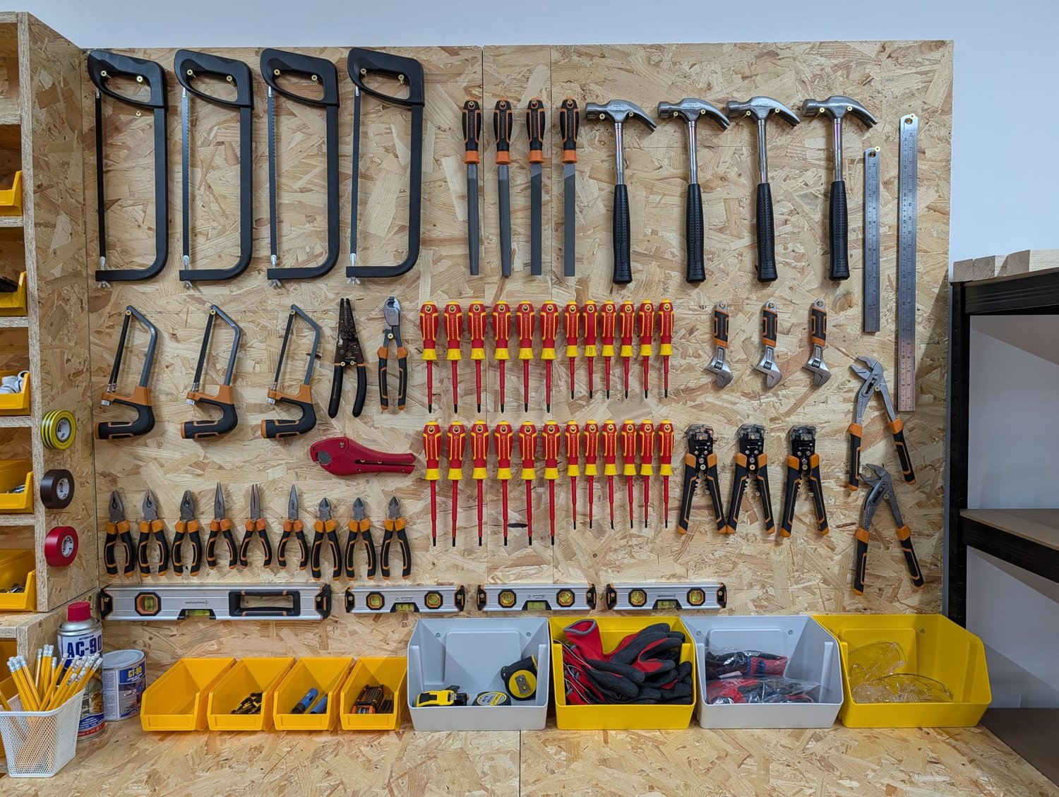 Tool wall with hand tools in the Optima Taunton workshop