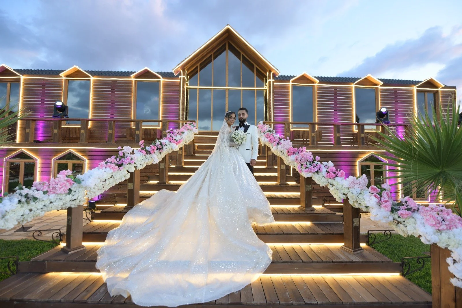 Sewing materials on beige fabric including scissors, measuring tape, thread spool, and bobbin.