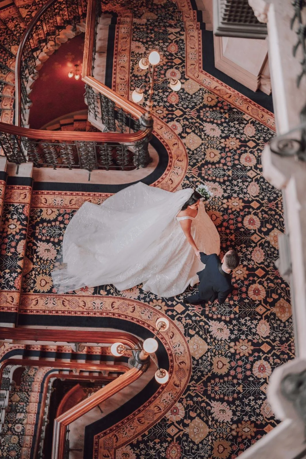 Sewing materials on beige fabric including scissors, measuring tape, thread spool, and bobbin.