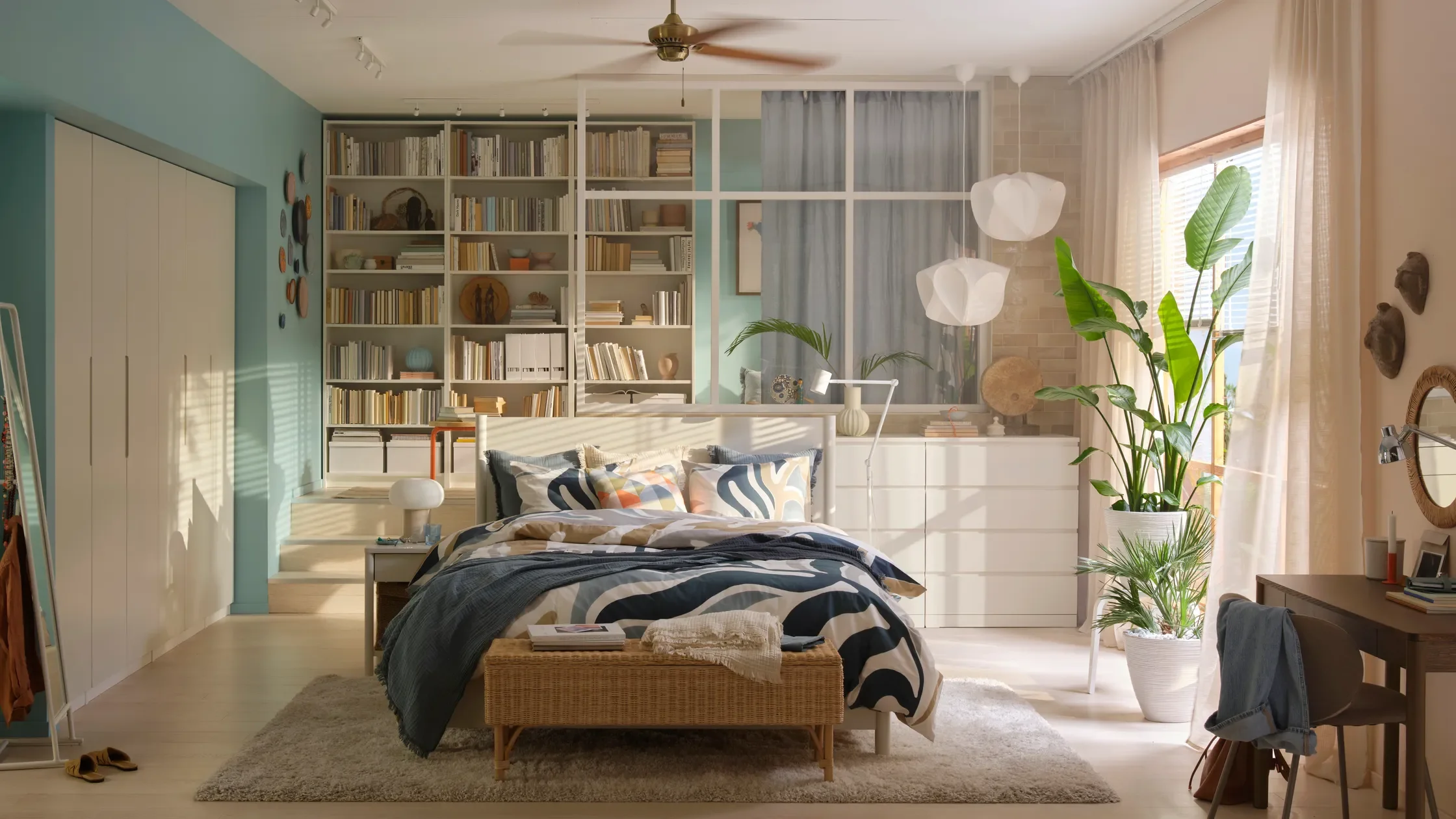 Give Your Bedroom a Fresh New Look for Spring Reinvigorate your bedroom with new, affordable home furnishings and storage solutions from IKEA — Photo of a beautiful modern bedroom with shelving, a bed, plants in pots, a desk, a rug, lighting, etc