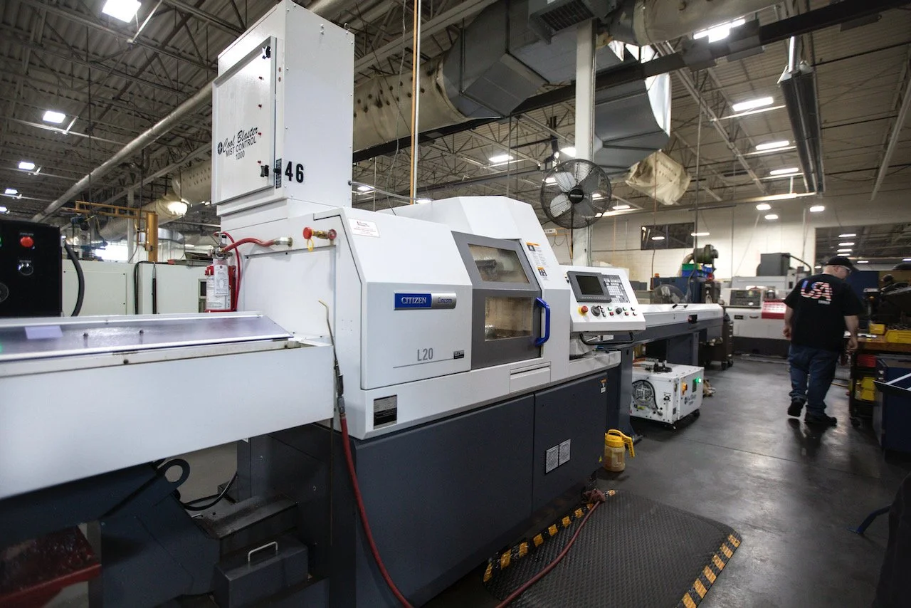 Industrial cutting machine in a factory setting
