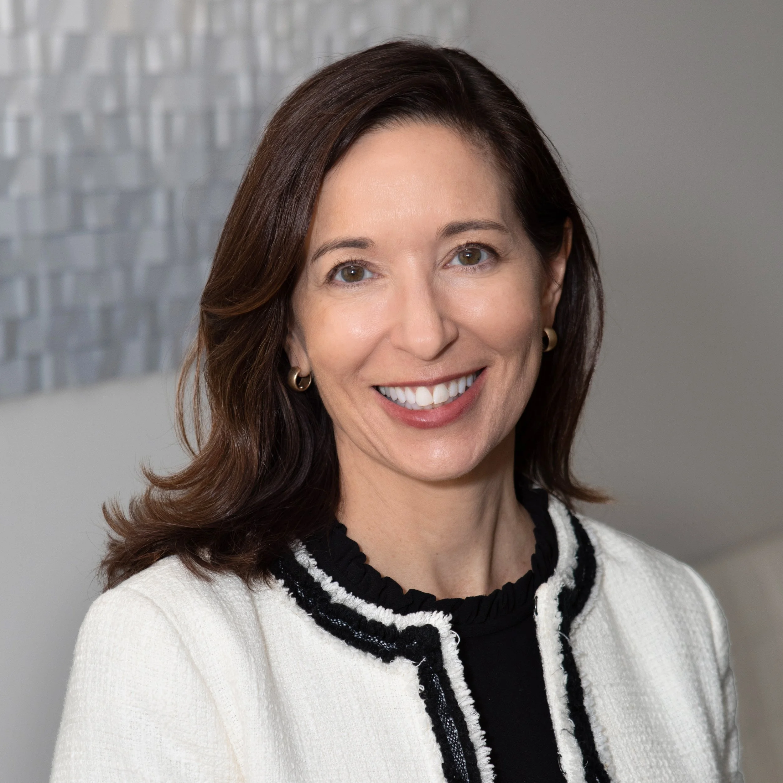 HDB Vice President and Operations Director Jennifer Hill, CPCU, smiling with professional background.