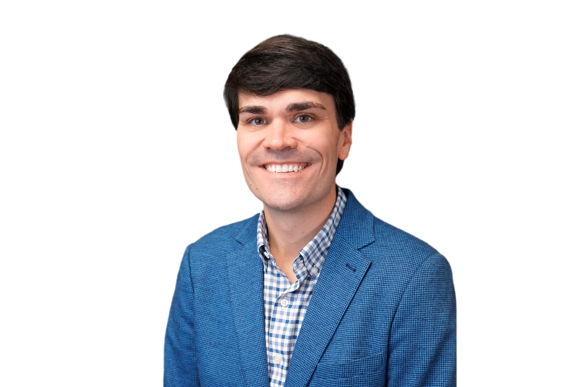 Brent Allred, Higginbotham Transportation Division Leader, smiling for a headshot in a blue blazer and checkered shirt.