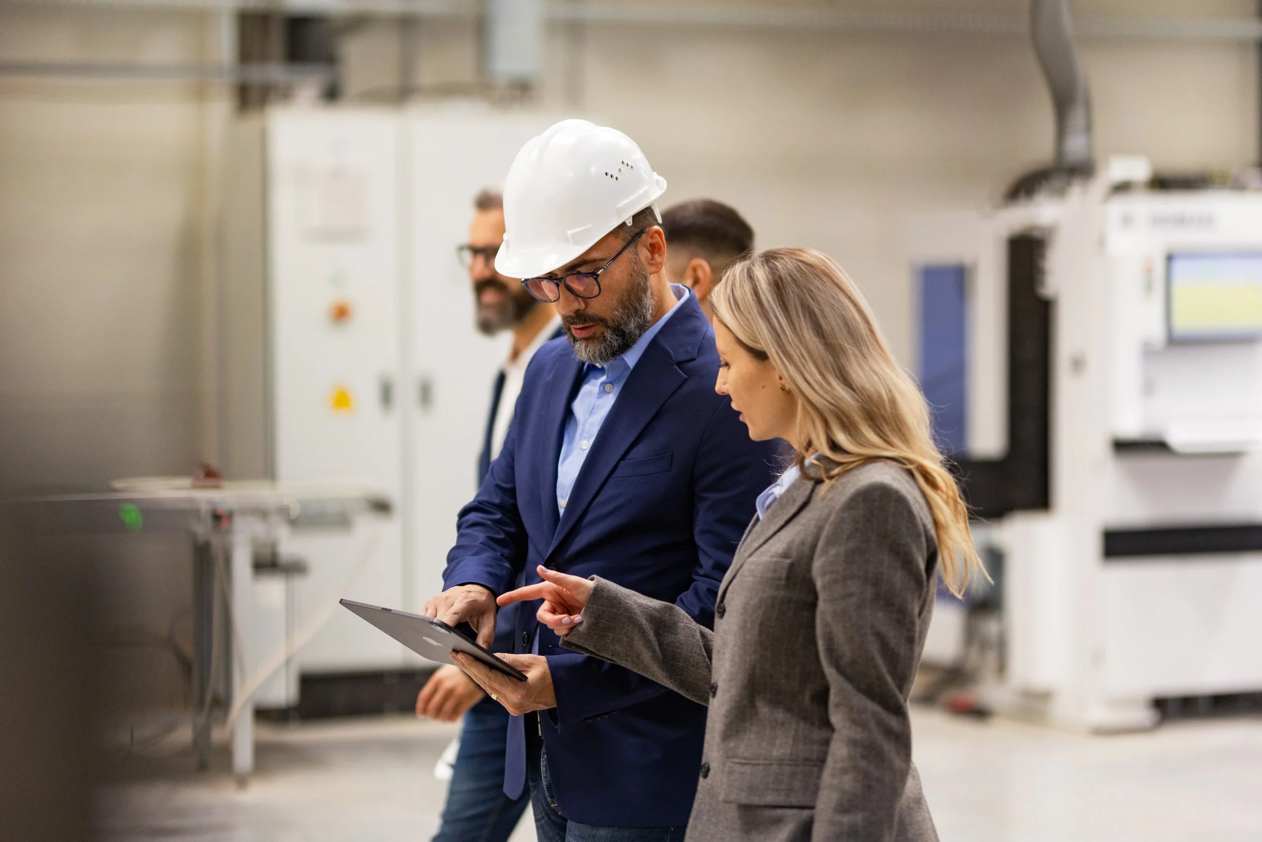 Employees working together in a modern manufacturing facility.