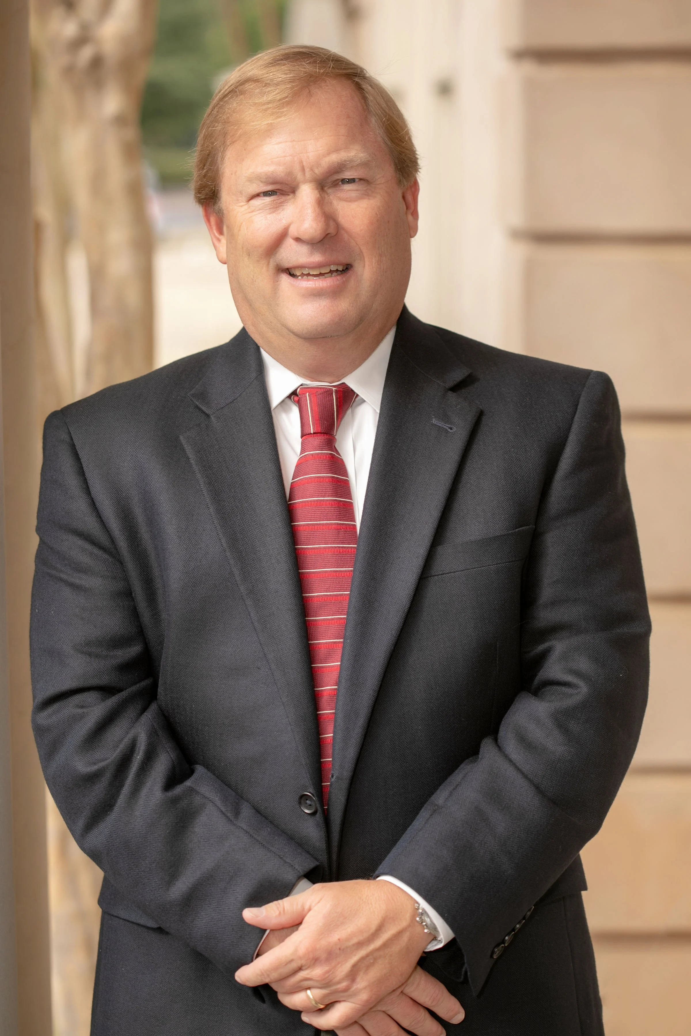 HDB President David J. Dennis, CPIA, smiling with professional background