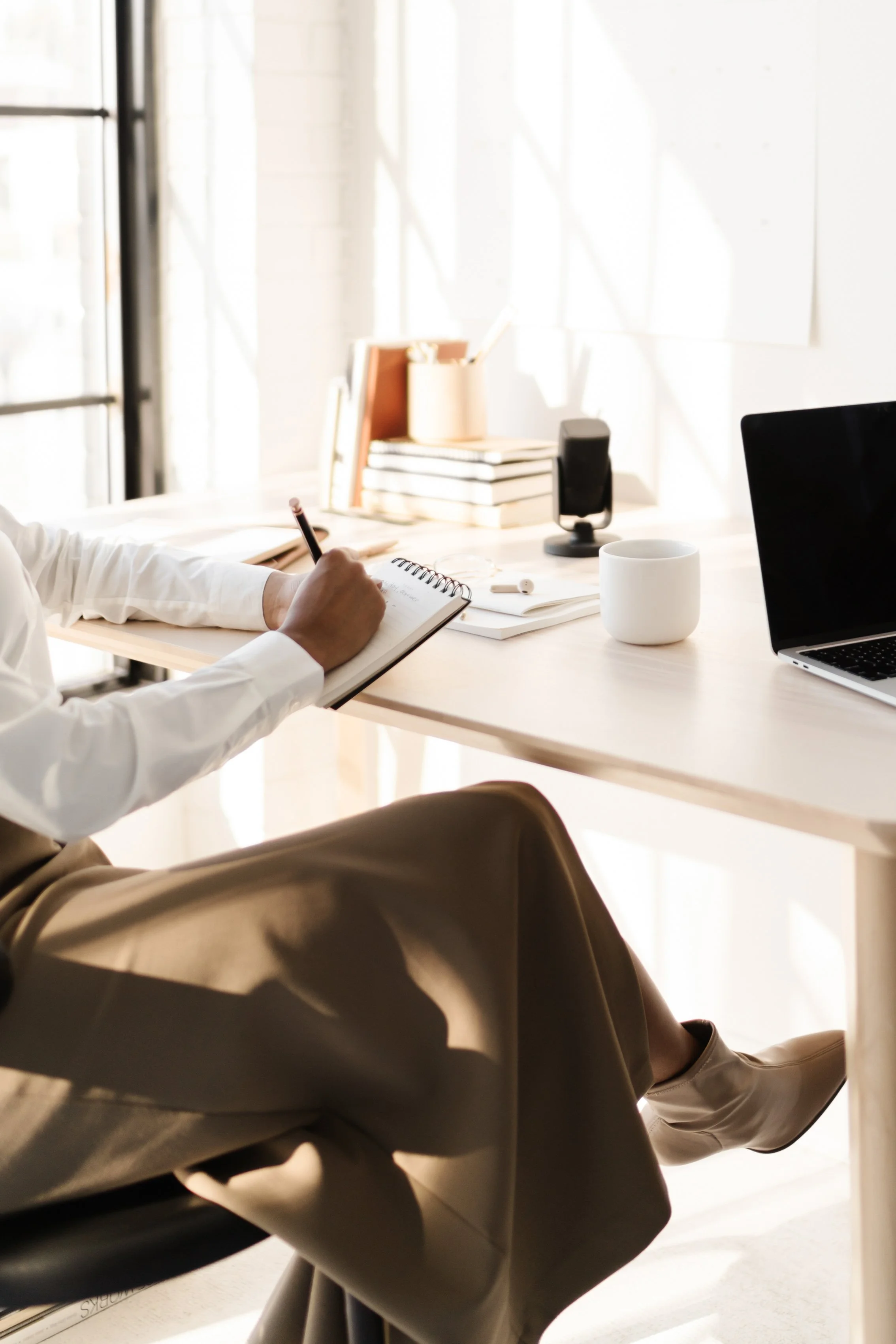 Confident CEO discussing strategic communications and PR partnership with team