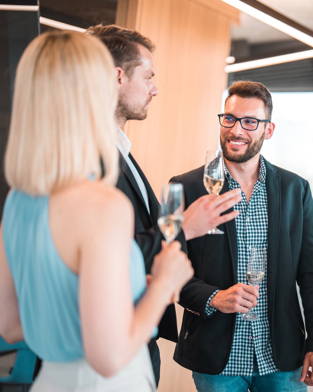 Professionals sharing a toast at a business gathering to represent gratitude-driven relationships