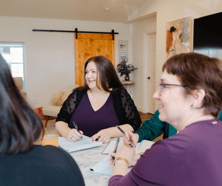 Kwedar & Co. team members in a planning session, drafting content for a strategic PR campaign