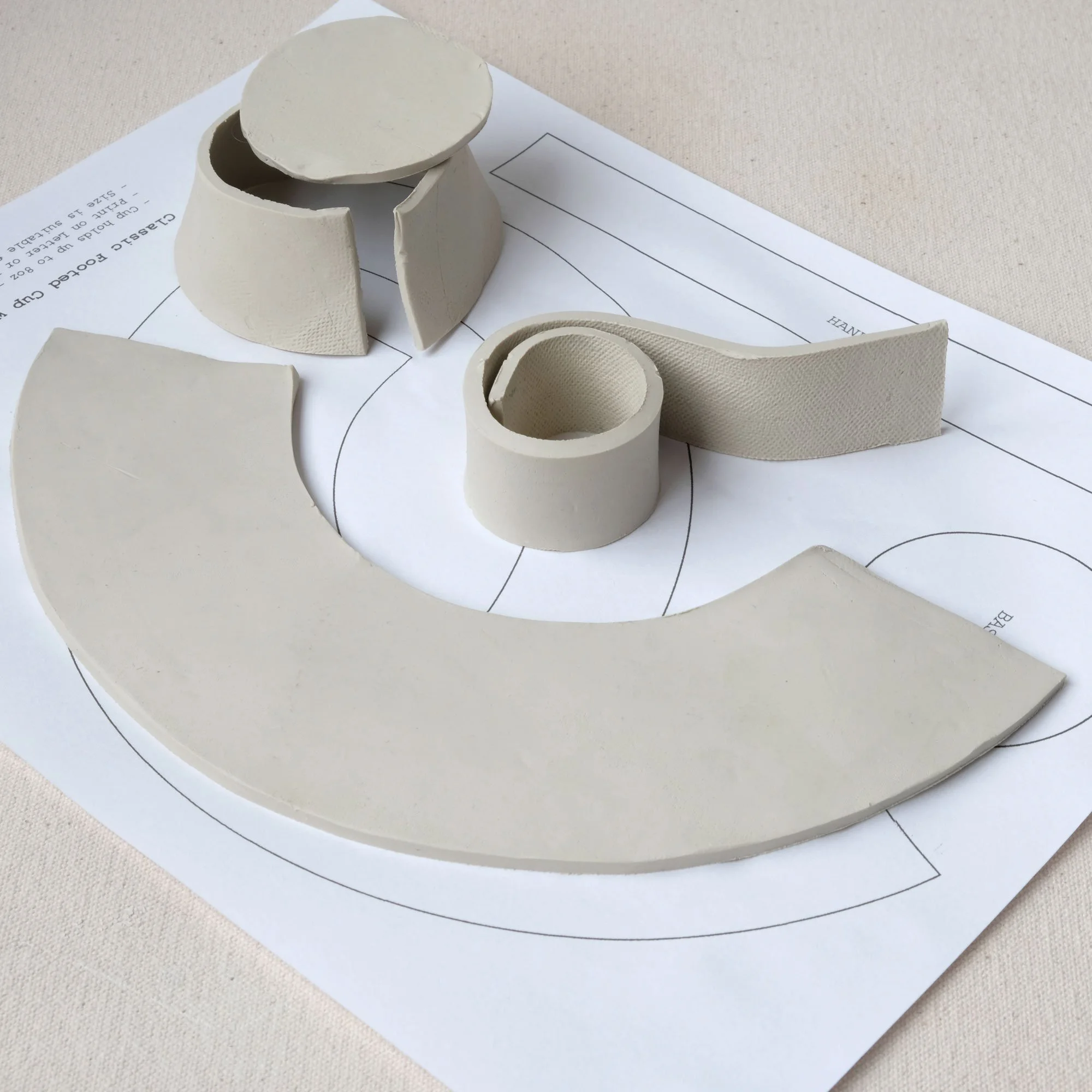 Printable pottery template for tea cup with cut clay slabs ready for assembly