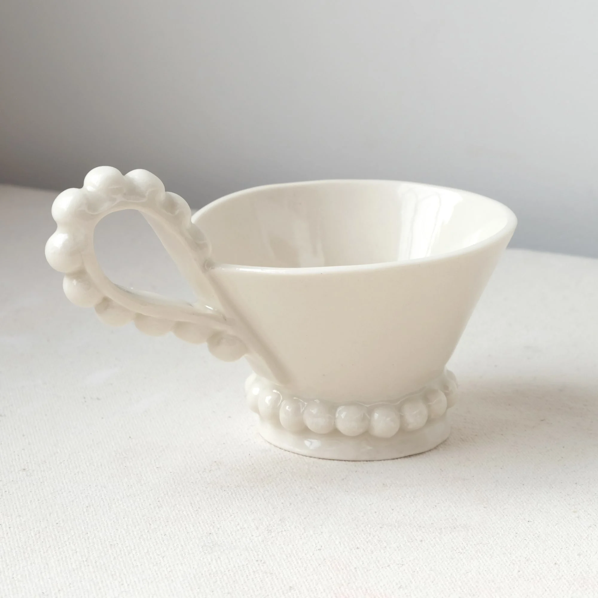 finished pottery template cup with clear glaze