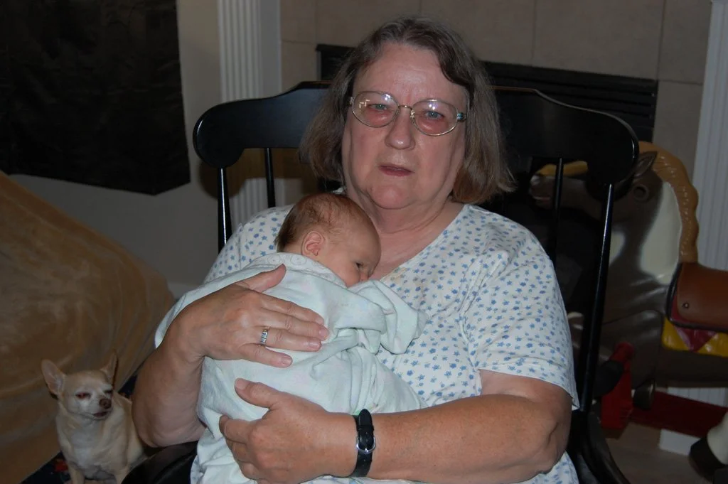 Picture of a grandmother holding a baby