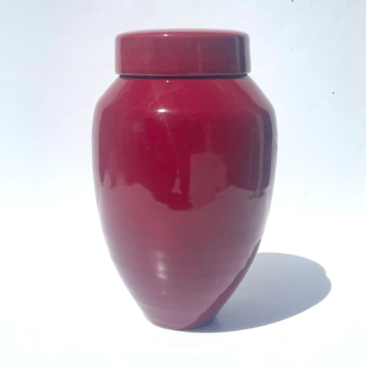 Minimalist handmade ceramic urn with a soft satin glaze, designed for a modern and elegant tribute.Made in Auckland.