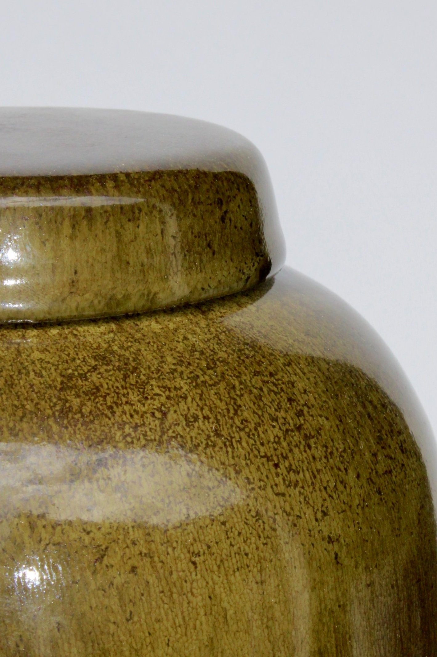 Green ceramic urn inspired by Pounamu (New Zealand greenstone), featuring a rich satin finish and natural stone-like texture, made in Auckland.