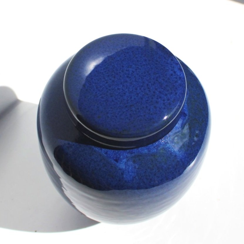 Minimalist handmade ceramic urn with a soft satin glaze, designed for a modern and elegant tribute.Made in Auckland.