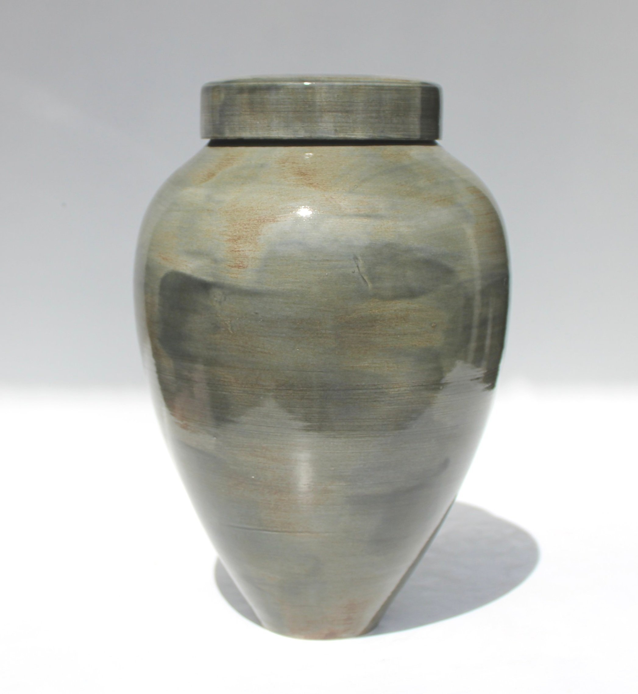 Bespoke ceramic urn with a hand-painted design, personalised to honour a loved one with a unique and meaningful tribute.