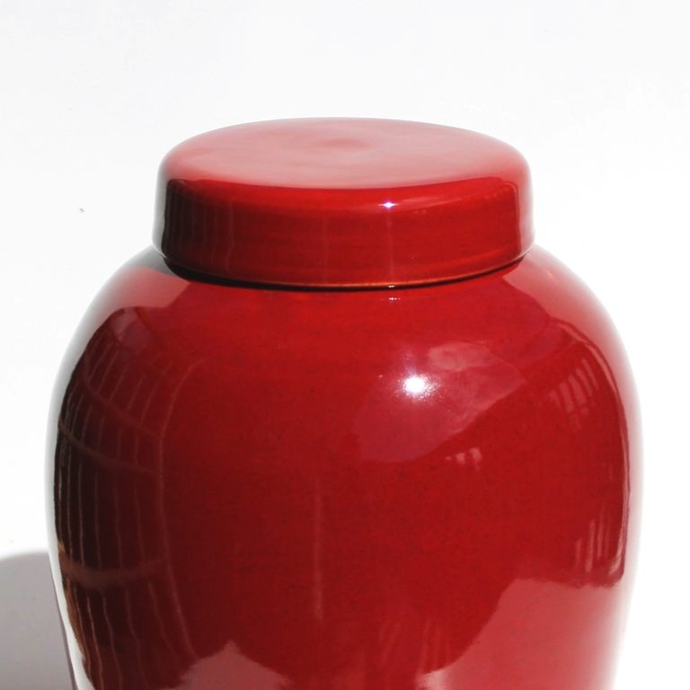 New Zealand handmade ceramic urn with a smooth, glossy glaze in deep blue tones, offering a timeless and elegant memorial option.