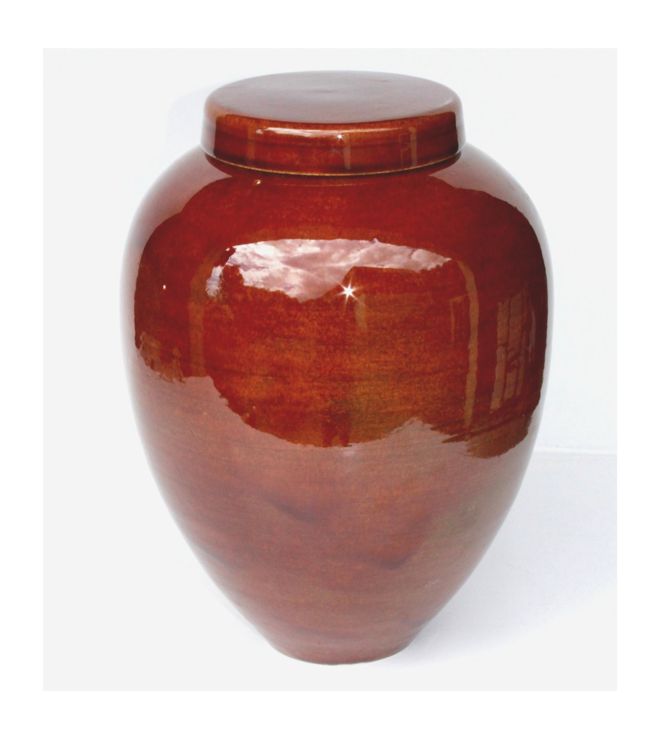 New Zealand handmade ceramic urn with a smooth, glossy glaze in deep blue tones, offering a timeless and elegant memorial option.