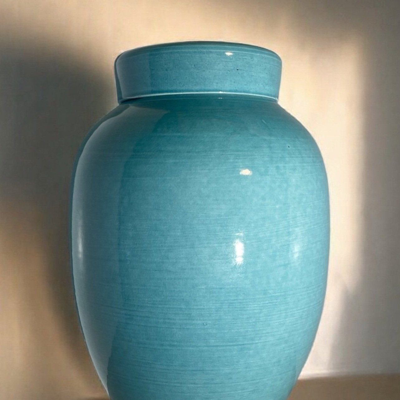 Handmade ceramic urn with unique crackle patterns and earthy tones, crafted in Auckland, New Zealand.