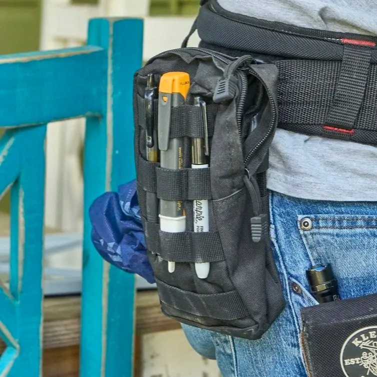 Close view of electrician tool pouch outdoors, representing residential electrical service inspection, amperage assessment, and upgrade planning.
