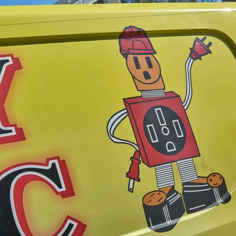 Close view of electrician inspecting vintage knob and tube wiring system during electrical safety assessment in older Florida home.