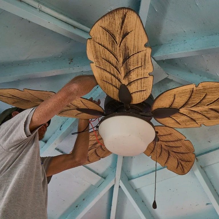 Outdoor ceiling fan installation on Florida lanai showing weather resistant fan improving air circulation and comfort in humid conditions.