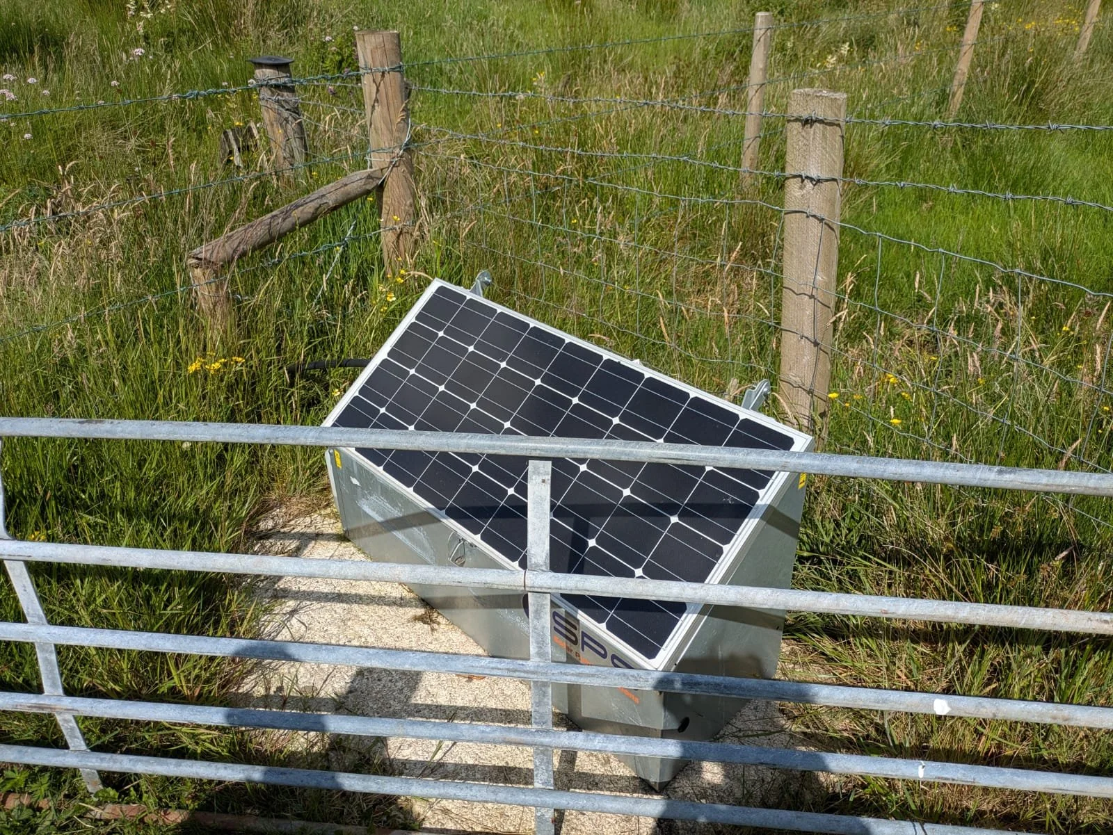 Solar powered pump, supplying water to a drinking trough from a nearby river.